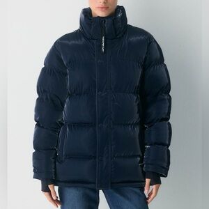 The Super Puff Aritzia Liquid Shine Puffer Coat